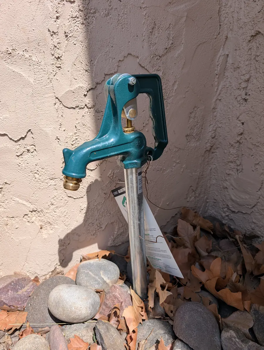 Frost-free yard hydrant installed on a gravel drainage bed